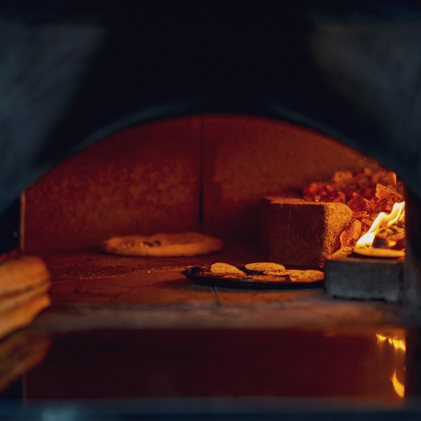 Members collaborating in a modern kitchen, exchanging recipes and techniques